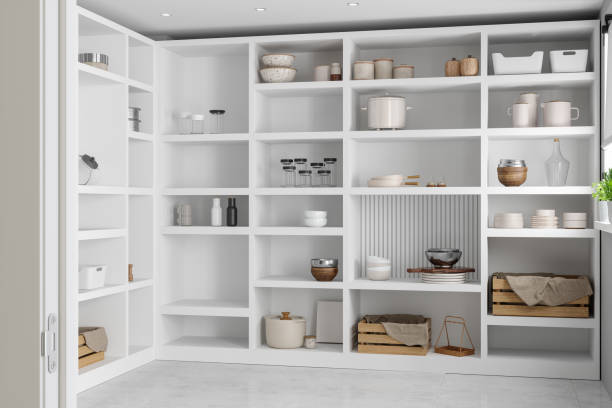 Storage Room With Empty Jars, Crates And Boxes On Pantry Shelves