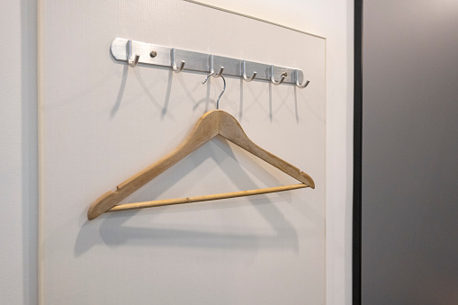 There is a clothes hanger hanging on the wall