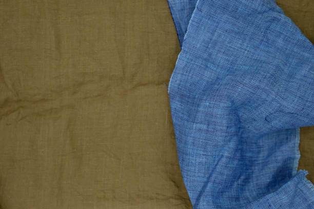 istock Blue linen fabric. Blurred brown canvas. 1914654611