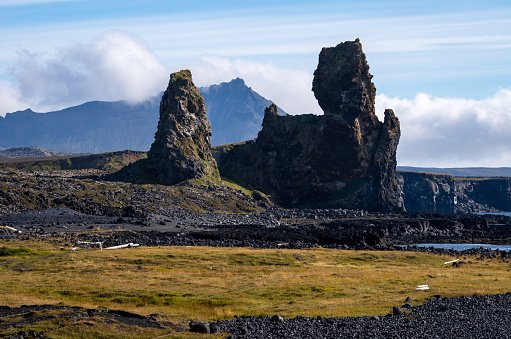 Lóndrangar volcanic cliffs at south coast of Snæfellsnes Peninsula and part of Snæfellsnes National Park, Iceland