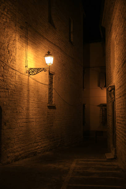 istock single old lantern in a dark alley 1914675621