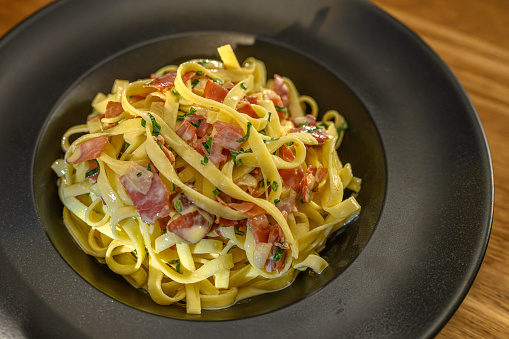 Fettuccine pasta with pancetta, egg, parmesan and pecorino cheese.