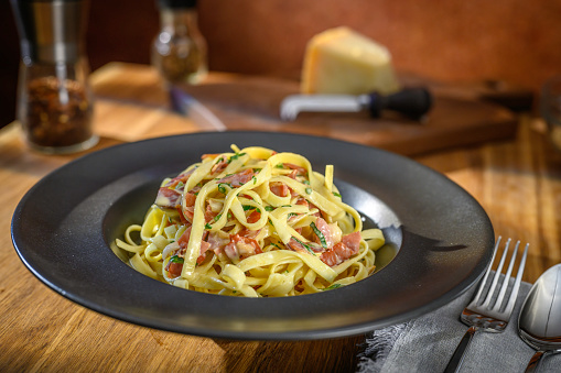 Fettuccine pasta with pancetta, egg, parmesan and pecorino cheese.