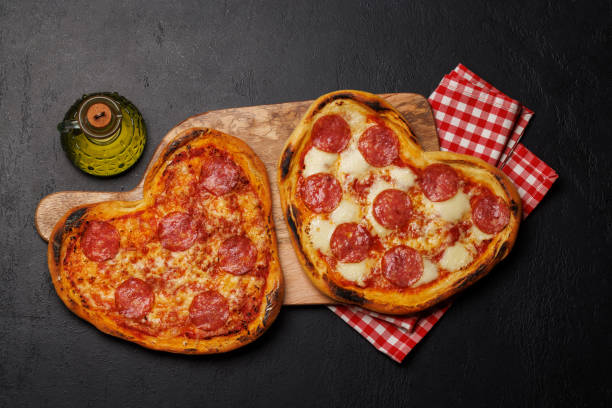 istock Heart-shaped pizzas: Delicious love-themed dish 1914722666