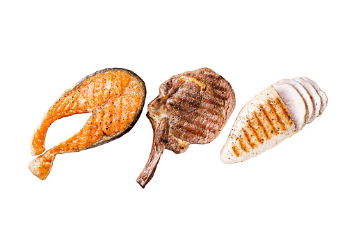 Barbecue grilled steaks - salmon, beef rib eye and turkey breast fillet Isolated on white background, top view