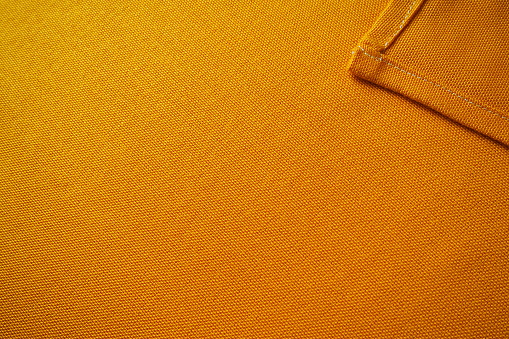 Cotton fabrics simply cotton. Textile industry. Trendy orange linen texture. Natural fabric background. Eco friendly raw sack cloth pattern. Burlap organic canvas. Texture yellow bright flax backdrop