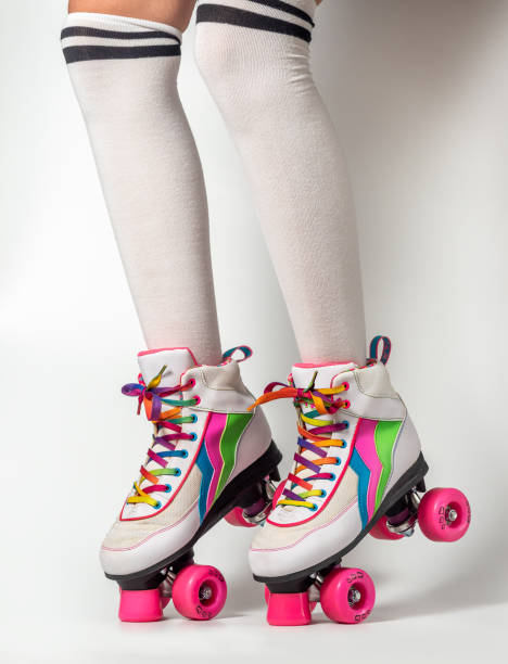 istock Girl legs wearing four-wheeled roller blades 1914821279