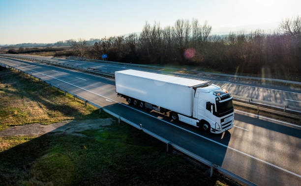 istock Delivery truck on the road with sunset 1914822326