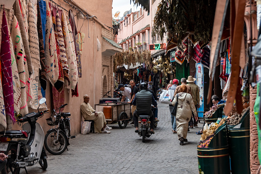 Marrakesh, Morocco - may 18, 2023: view of small street shops in narrow alleys in Marrakesh souk