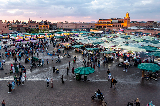 Marrakesh, Morocco - may 18, 2023: view from above of Jemaa El Fna Square which, at sunset, comes alive with dozens of street restaurants and crowds of tourists