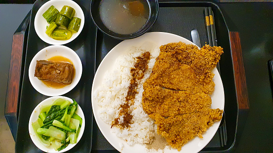 Traditional Meal Of Taiwanese With Rice, Fried Pork, Tofu, Pickles And Hot Soup.