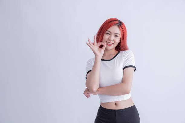 Asian woman showing okay gesture,