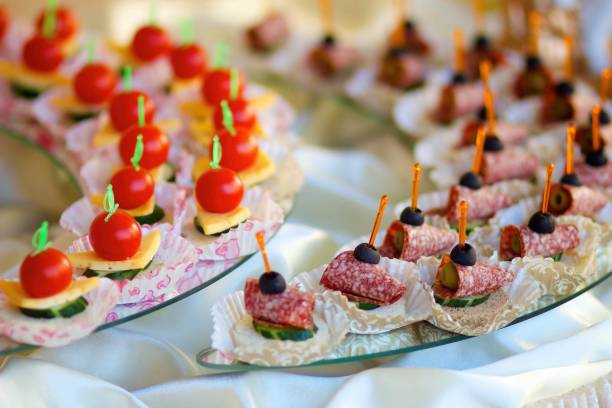 istock Assorted canapes and various delicacies on the festive table. Snacks for guests at the event. 1914836401