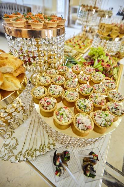 istock Assorted canapes and various delicacies on the festive table. Snacks for guests at the event. 1914836922