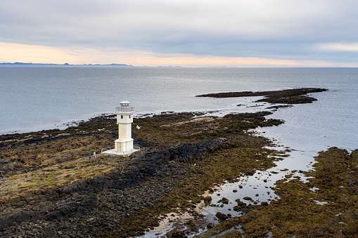 Old Akranes lighthouse at west coastline of Iceland on a calm day