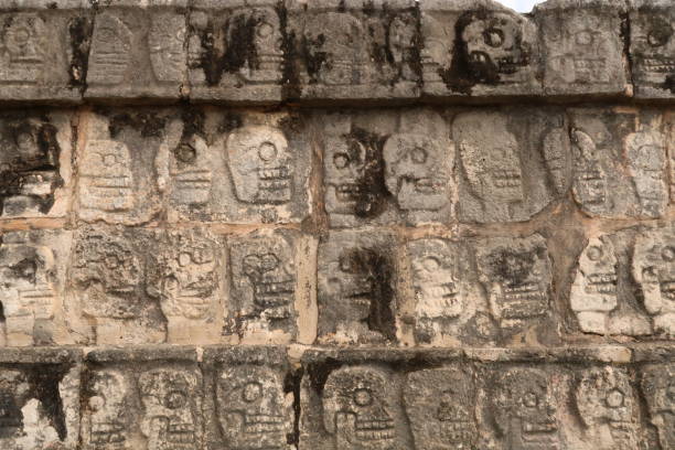 istock Skull pattern on the Tzompantli, skull platform, plataforma de los craneos, at Chichen Itza, close to Valladolid, Mexico 1914912635