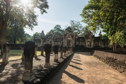 Prasat Sdok Kok Thom ancient castle entrance against sun light at Sa Kaeo province, Thailand. Here is 11th century Angkorian temple in present-day Thailand