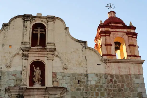 Facade of the church Iglesia Preciosa Sangre de Cristo with its beautiful bell tower and ornaments, Oaxaca, Mexico 2022