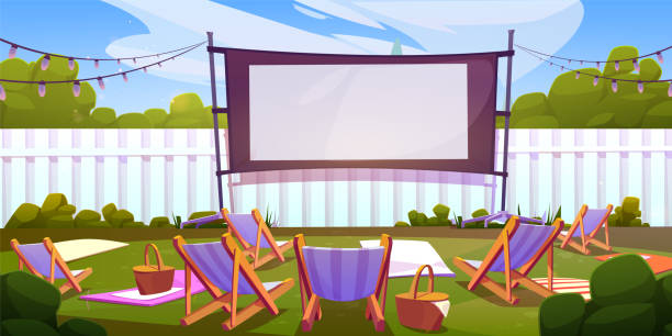 Outdoor cinema in summer park Outdoor cinema in summer park. Vector cartoon illustration of big movie screen with blank surface, chaise lounges and picnic baskets on backyard lawn, white fence, open air festival, weekend relax movie-theater-exterior stock illustrations