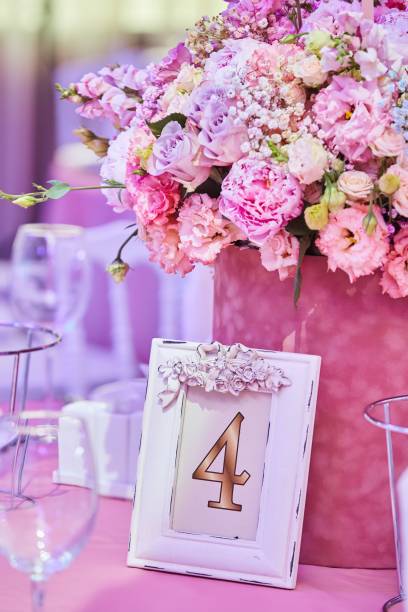 table number for a big celebration or celebration. seating of guests of a large event according to the list. details of the decor. - clipping path wedding invitation invitation message stock-fotos und bilder