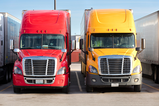 Two trucks parked at truck stop, American transport concept, Missouri, United States.