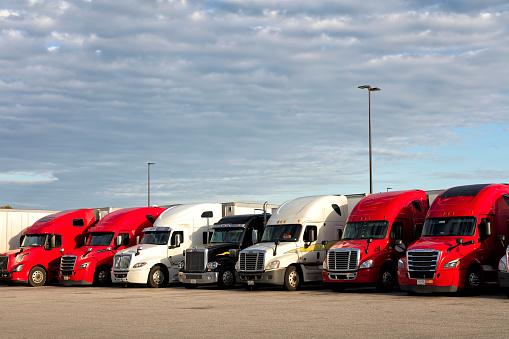 Group of semi trucks parked at truck stop, American transport concept, Missouri, United States.