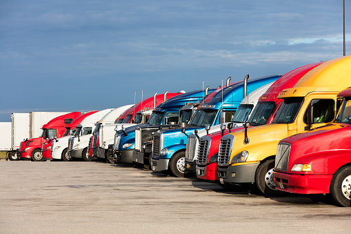 Group of semi trucks parked at truck stop, American transport concept, Missouri, United States.