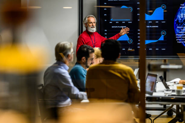 istock Man giving presentation in meeting room 1915184839