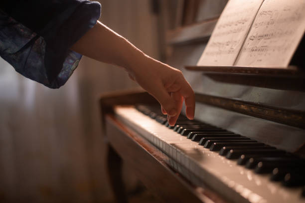 istock a pianist's hand is on the piano keys 1915230928