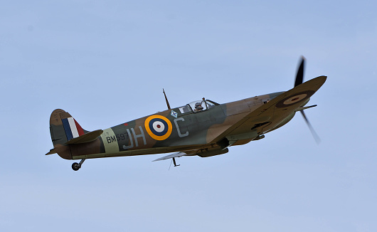 Little Gransden, Cambridgeshire, England - August 28, 2022: Vintage Supermarine Spitfire aircraft in flight.