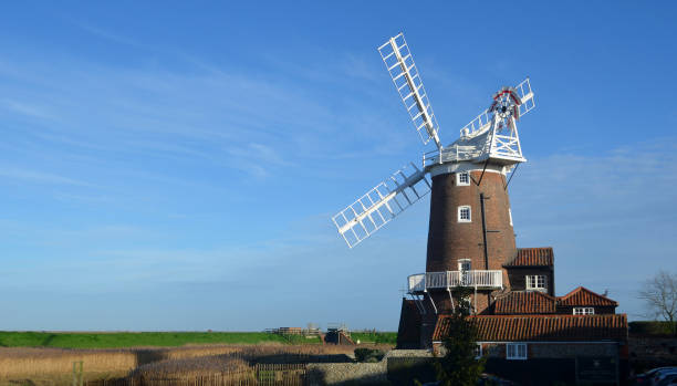istock Cley windmill and marshes North Norfolk England. 1915245067