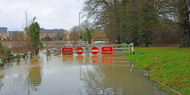 istock Flooding river Ouse causing bridge and road to be shut off. 1915246086