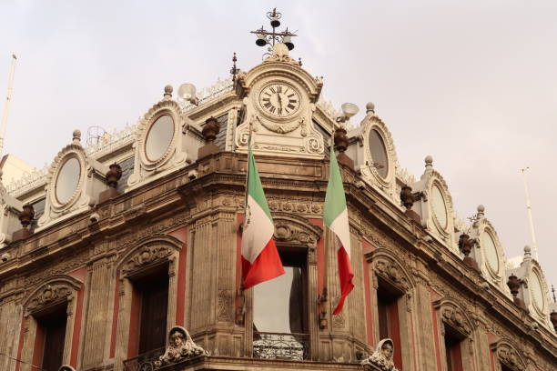 istock The top of building Edificio La Esmeralda with mexican flags, a clock, and many details and ornaments, Mexico City 1915253815