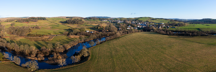 Aerial view of a small village in Scotland on a winter afternoon