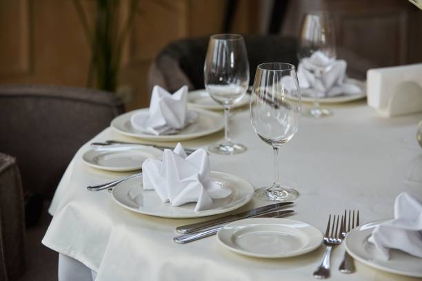 istock Crystal glasses for celebration, decorated for the holiday. Table setting. 1915259466