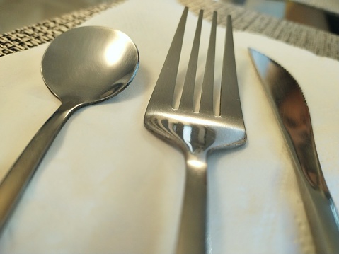 Fork spoon and knife in fine table set fine dining, fine dine in restaurant table set