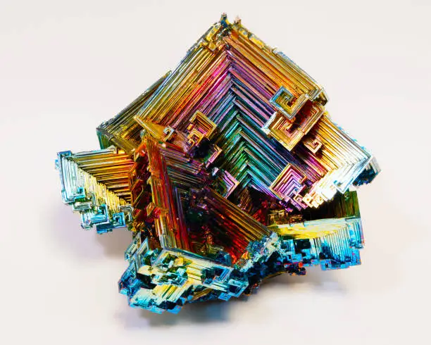 Close-up image of a bismuth crystal showing oxidation coloration.