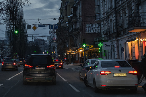 Kyiv, Ukraine - January 7, 2024. There are few cars on the roads on a weekend. almost empty roads. in the evening, the city is beautifully illuminated by car headlights.