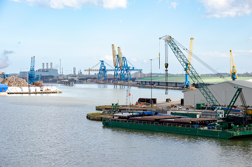 An image of the Port of Hull in England, showcasing its bustling activity and industrial might. As a significant maritime hub, the port features a landscape of shipping containers, cranes, and vessels, reflecting the city's long-standing heritage as a key player in maritime trade and commerce.
