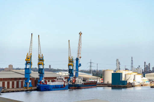 An image of the Port of Hull in England, showcasing its bustling activity and industrial might. As a significant maritime hub, the port features a landscape of shipping containers, cranes, and vessels, reflecting the city's long-standing heritage as a key player in maritime trade and commerce.