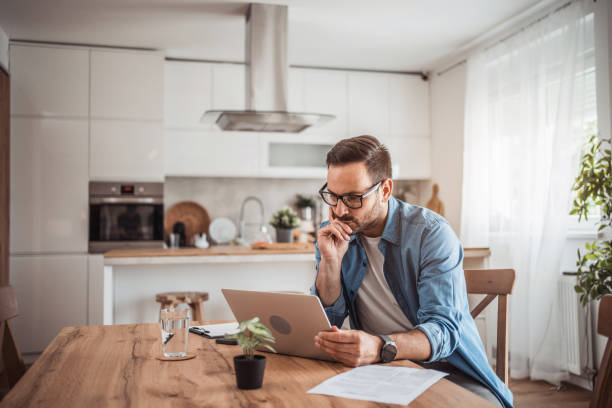 istock A young man works from home using a laptop 1915378305
