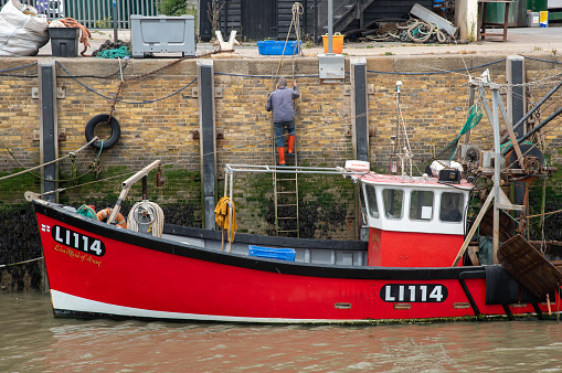 Whitstable, United Kingdom, June 8 2023: Fishing boat moored at Whitstable harbor in Kent England.