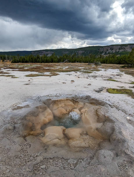 istock Storm clouds forming over geyser in Yellowstone National Park 1915469975