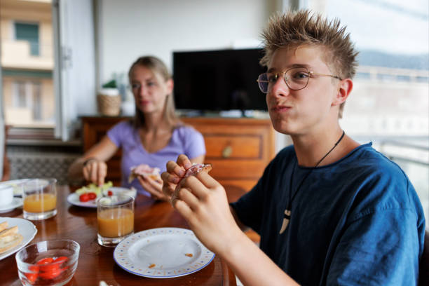 istock Family enjoying eating breakfast together 1915516481