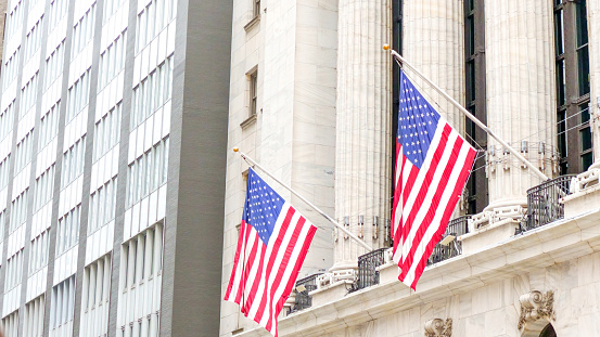 American flags on the main facade of the New York Stock Exchange - NYSE Building in the Financial District of Lower Manhattan in New York City is seen on July 4th, 2023.