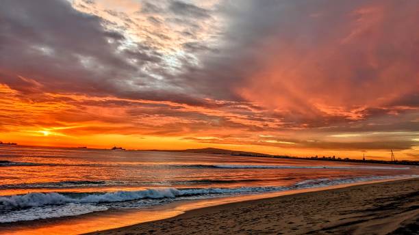 istock Huntington Beach Sunset over ocean 1915538247