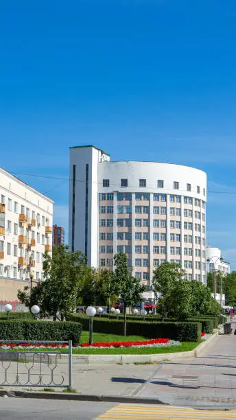 Town of Chekists or agent of Cheka secret police. NKVD House in Yekaterinburg. Complex of buildings in constructivist style. Building in form of horseshoe. Vertical image.