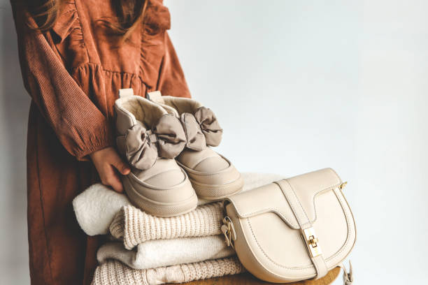 istock Stack of sweaters and boots, style and fashion 1915632095