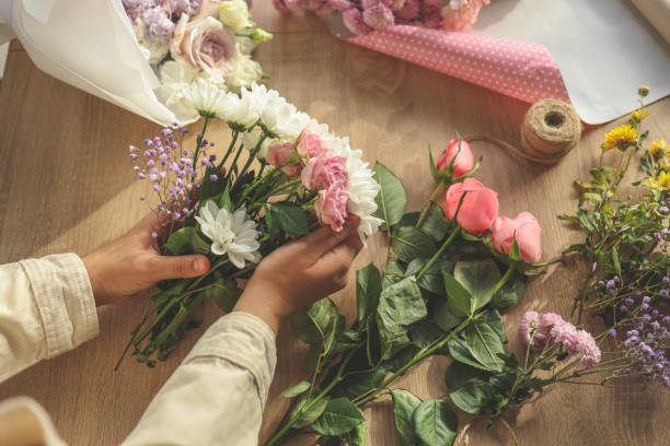 istock Florist at work. Woman making autumn floral decorations 1915640975