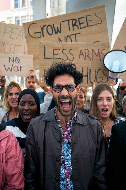 istock Multiracial diverse ages people protesting against war and violence in the world. Group of activists 1915695282